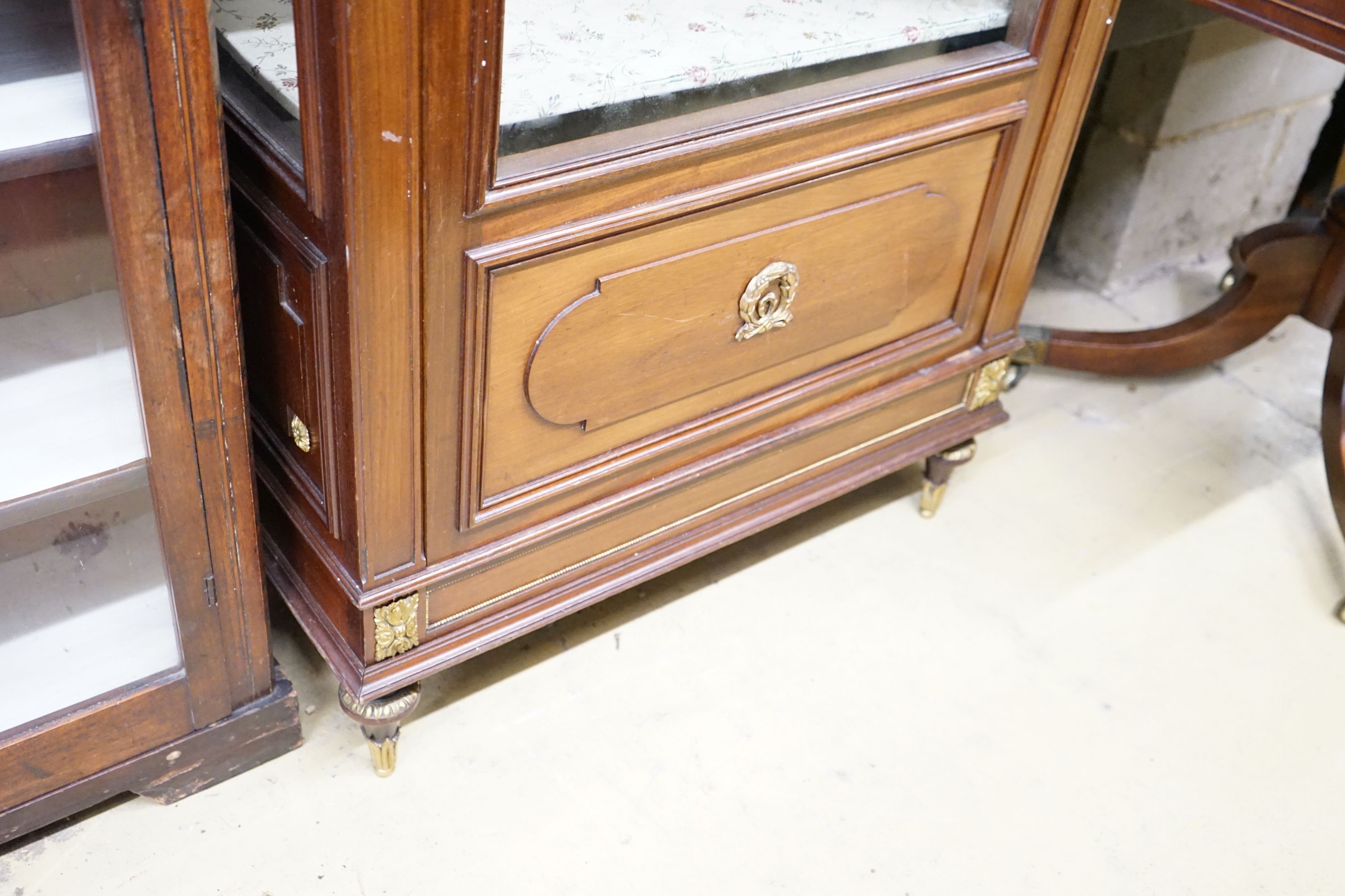 A French gilt metal mounted glazed mahogany vitrine, width 76cm, depth 35cm, height 163cm